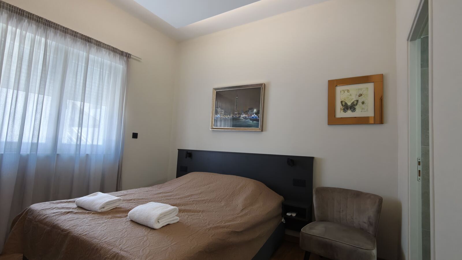 Standard double room with cityscape and butterfly artwork, St. Lazarus City Hotel Larnaca
