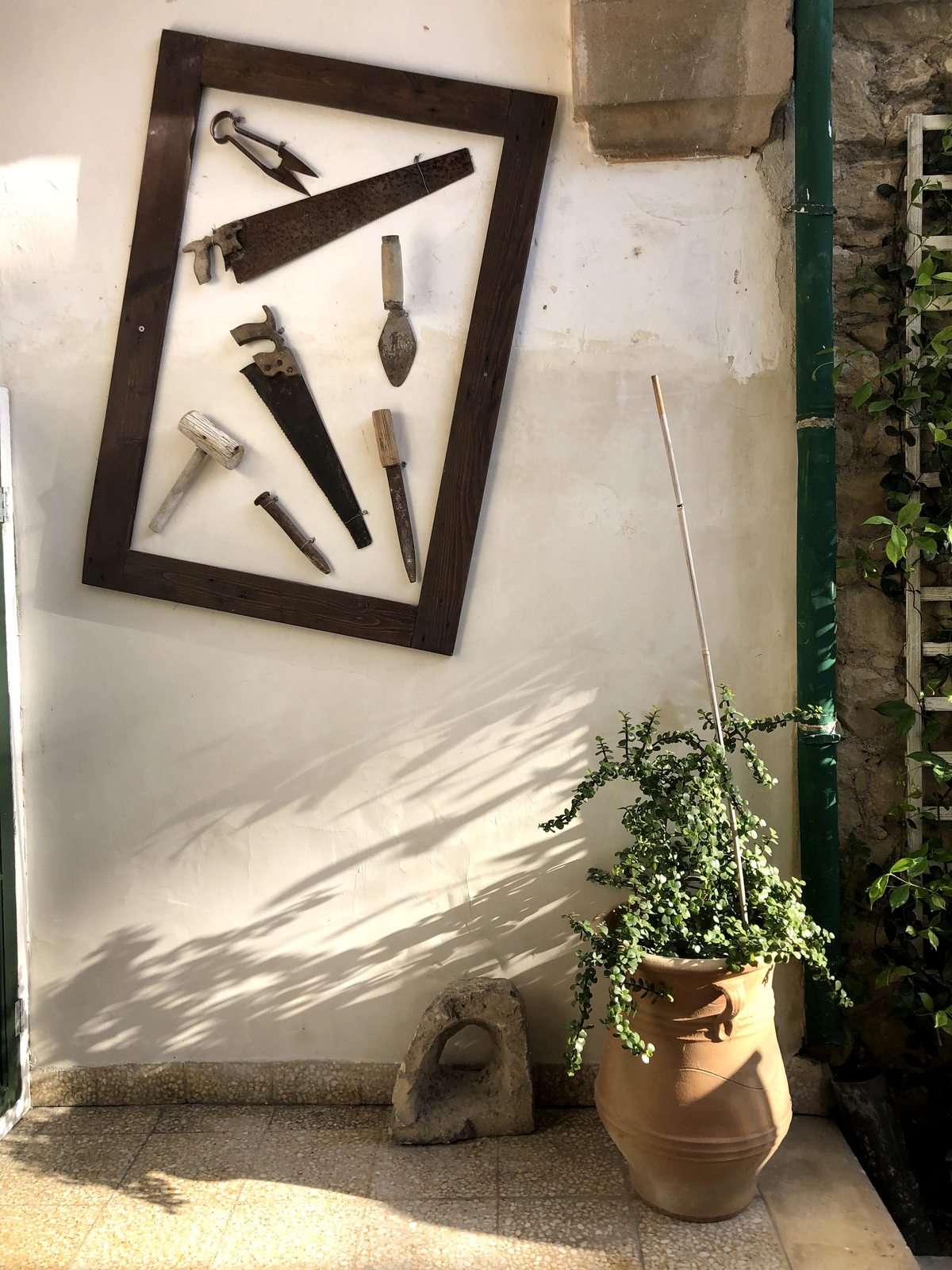 Lobby seating area at Le Mat Hostel, looking out through the open street door