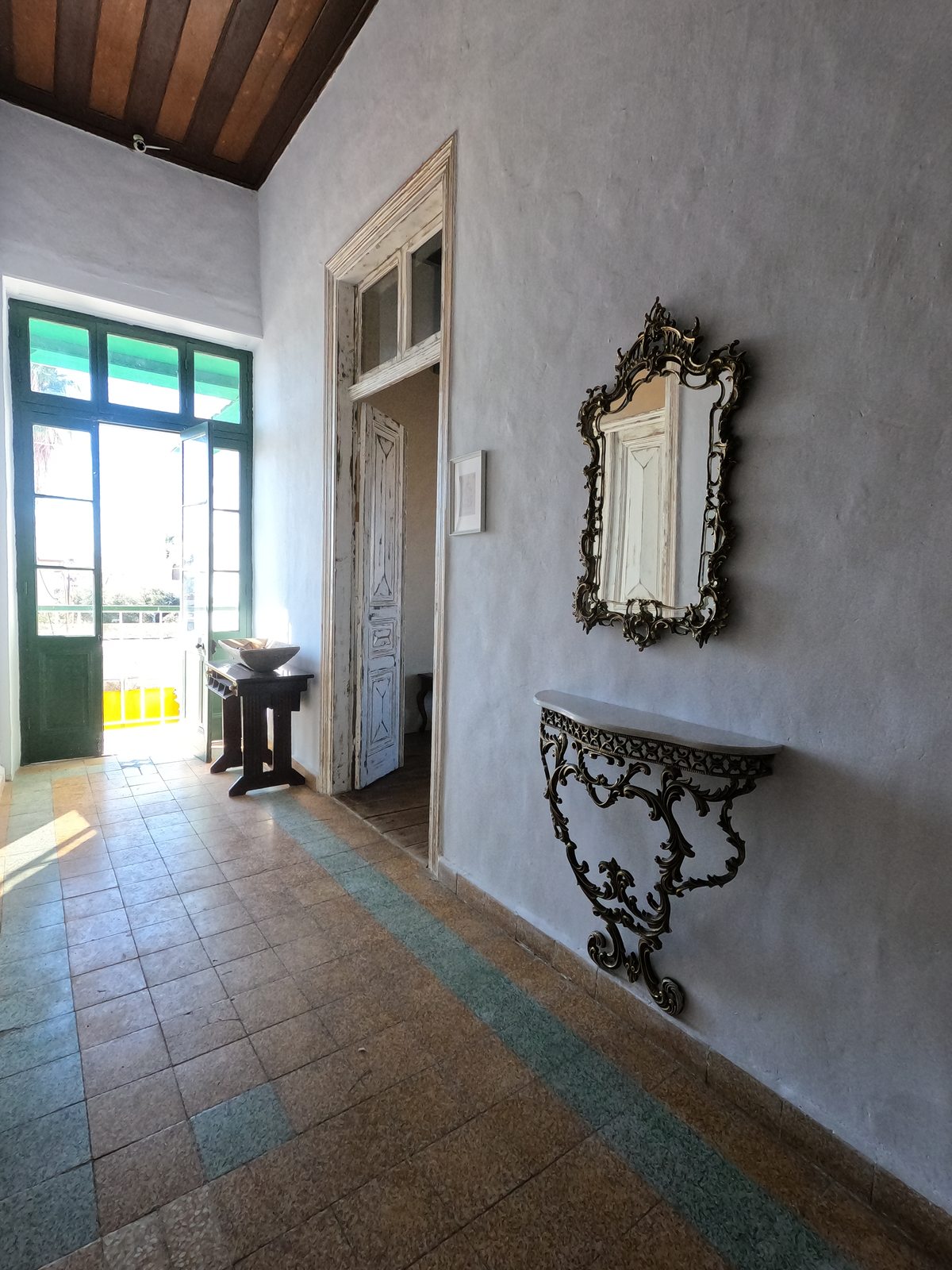 A lobby nook at Le Mat Hostel near the staircase