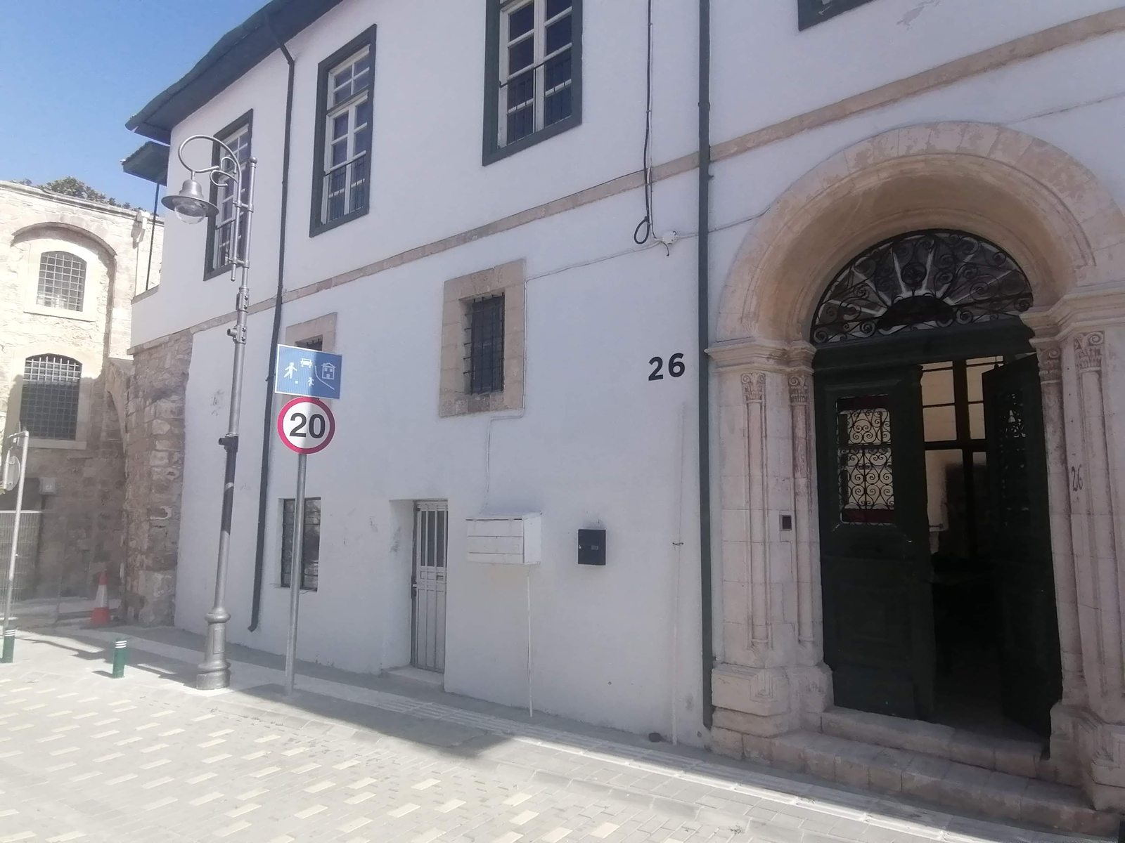 The stone archway over the street outside Le Mat Hostel