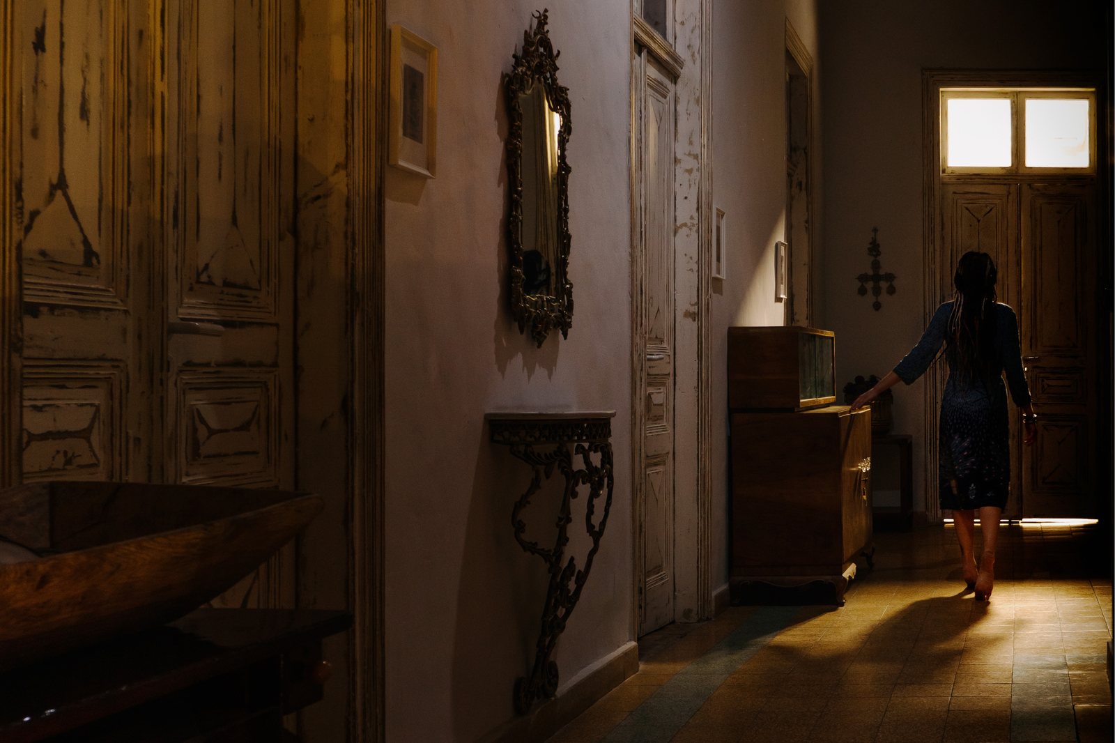A softly lit hallway inside Le Mat Hostel's old building