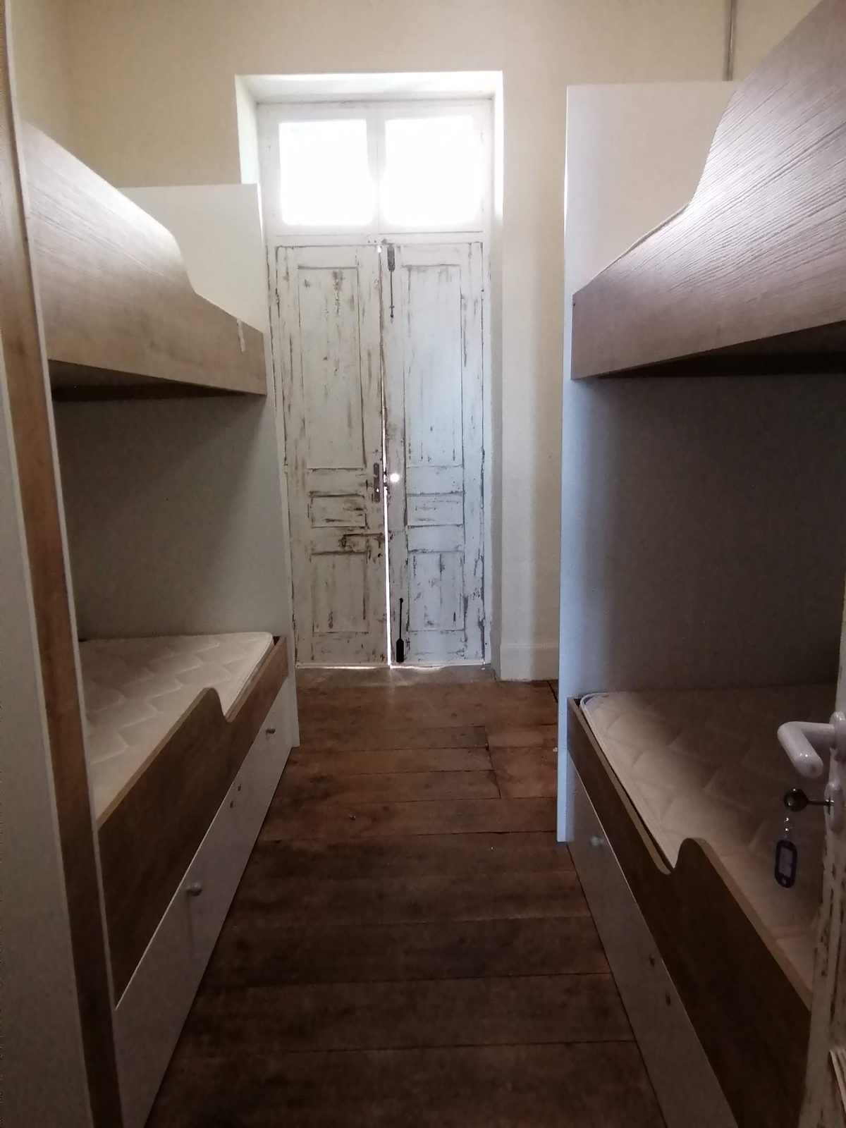 La Lune dorm hallway with original wooden doors